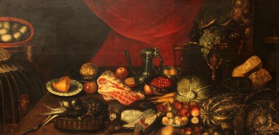 Manner of Giovanni Battista Ruoppolo (1629-1693) Still life of vegetables, meat, fruit and poultry on a table top 32 x 65in.